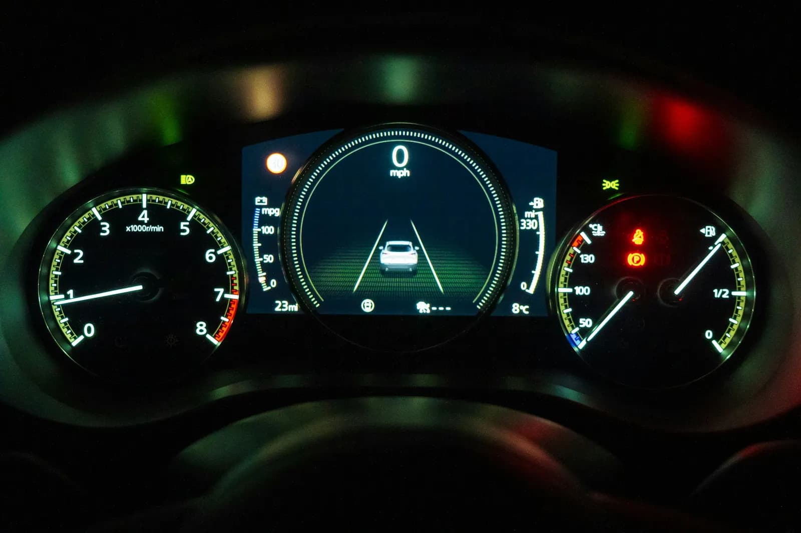 Digital instrument cluster displaying driver-assistance graphics