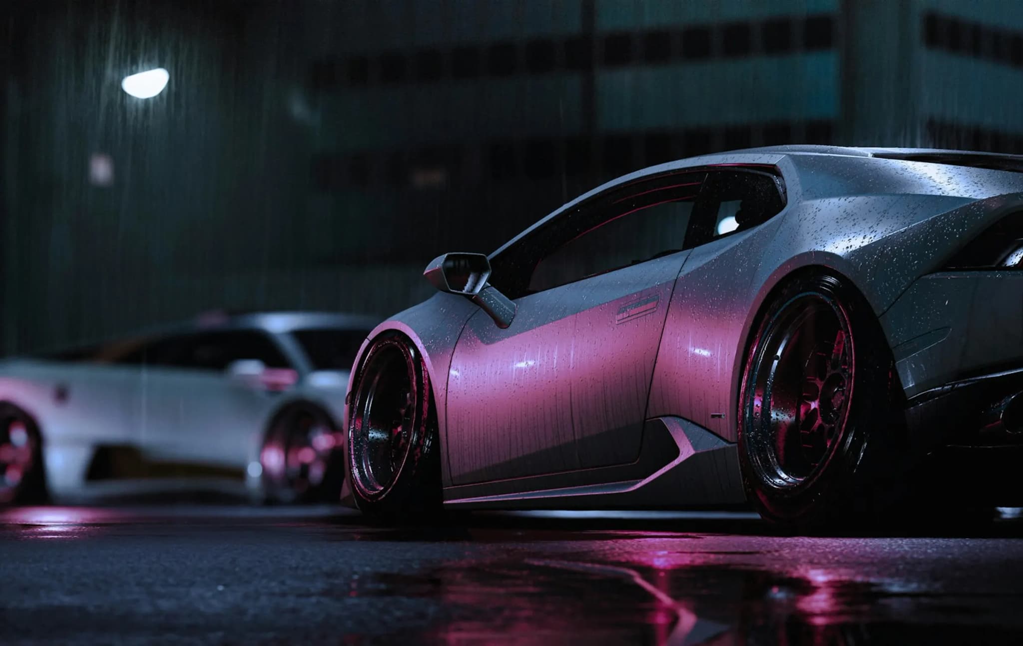 Lamborghini supercars parked on a wet city street at night