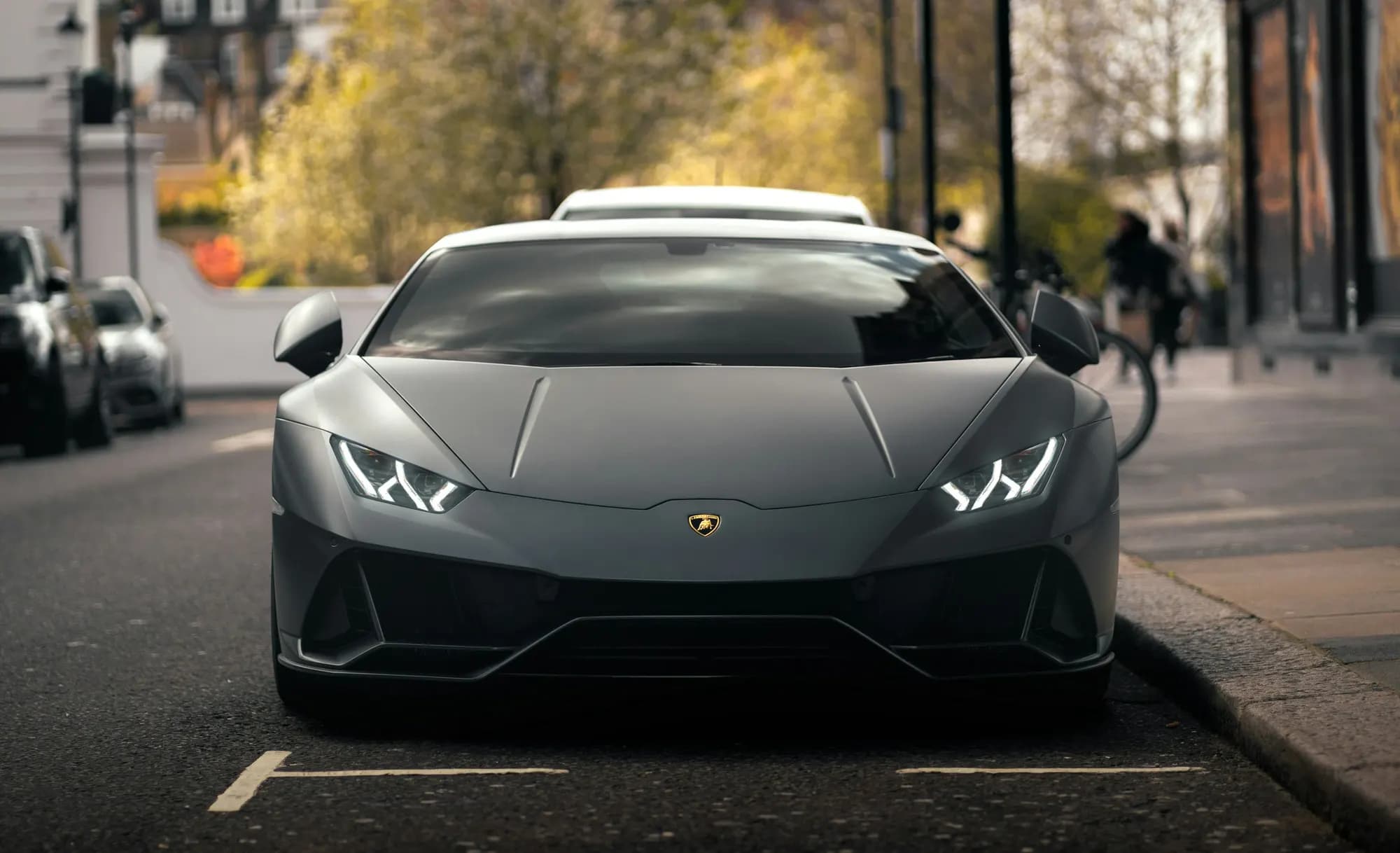 Matte grey Lamborghini Huracán EVO, front view on a city street